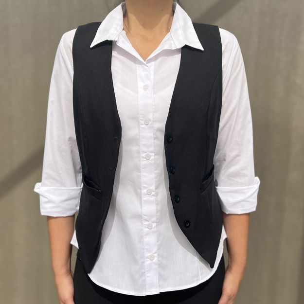 Female model wearing a black waistcoat over a white shirt.