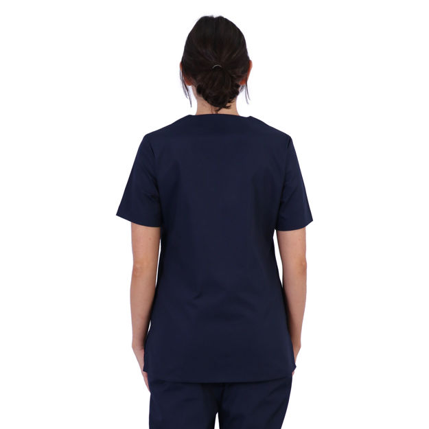 Female model wearing navy scrub top shown from the back.