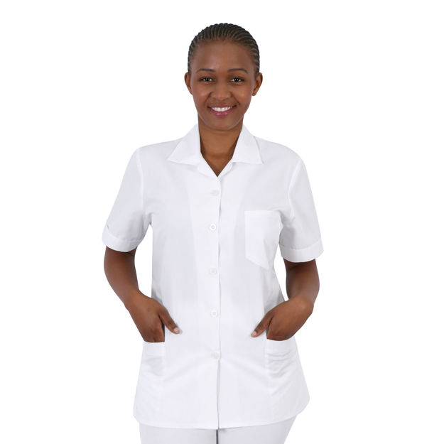 Female model wearing a white beauty therapist uniform top.