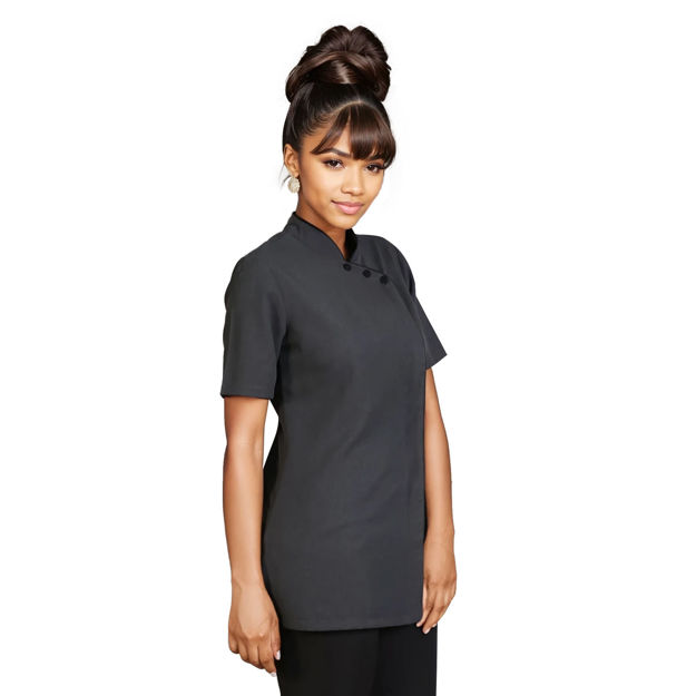 Female model wearing a black scrub top with white piping.