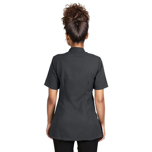 Female model wearing a black scrub top shown from the back.