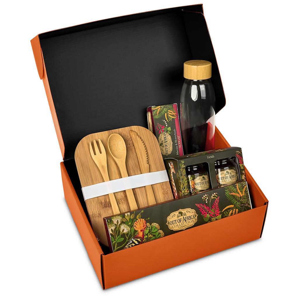 Open black gift box with assorted promotional merchandise.