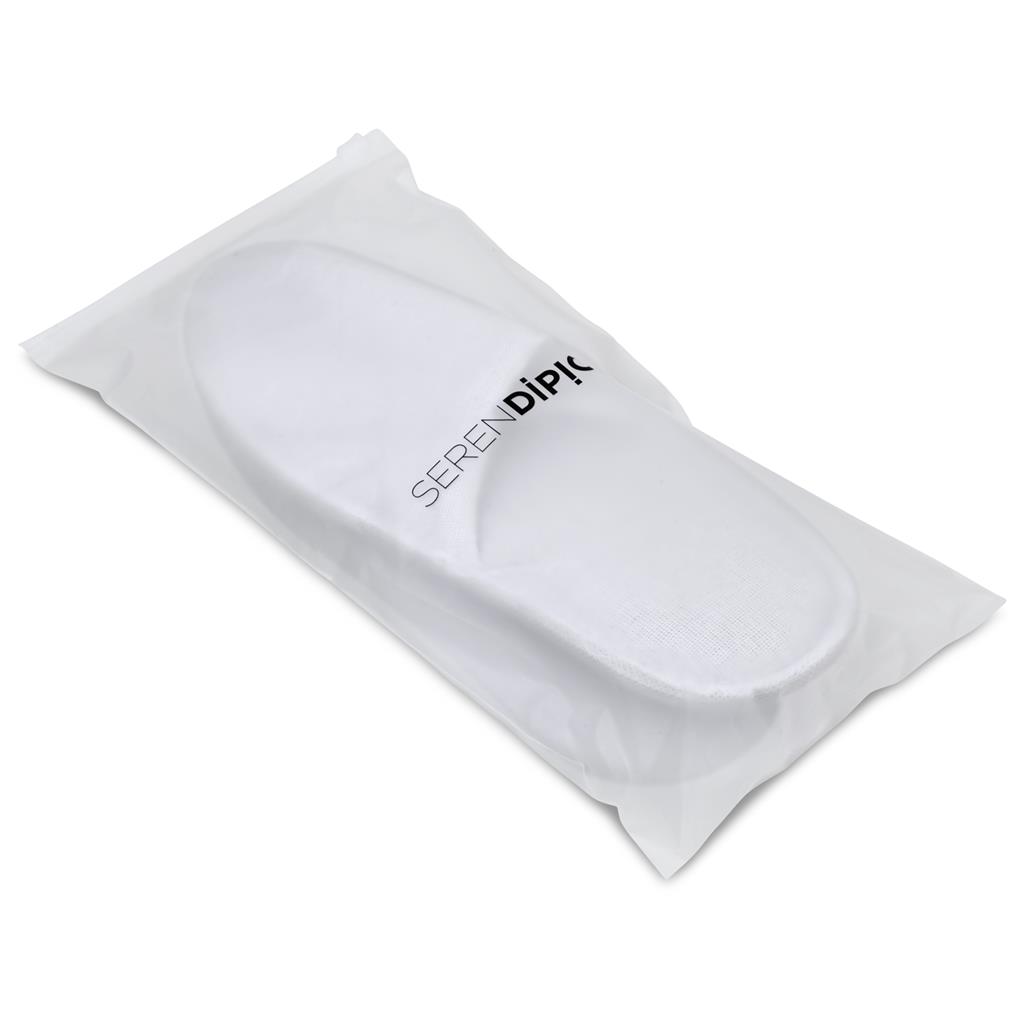 White slippers packaged in a clear travel pouch.