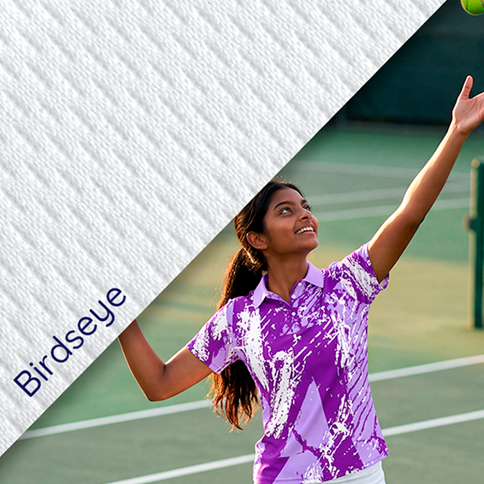 Female athlete wearing green and purple sportswear.