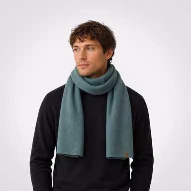 Male model wearing a dark green knit scarf or neck warmer.