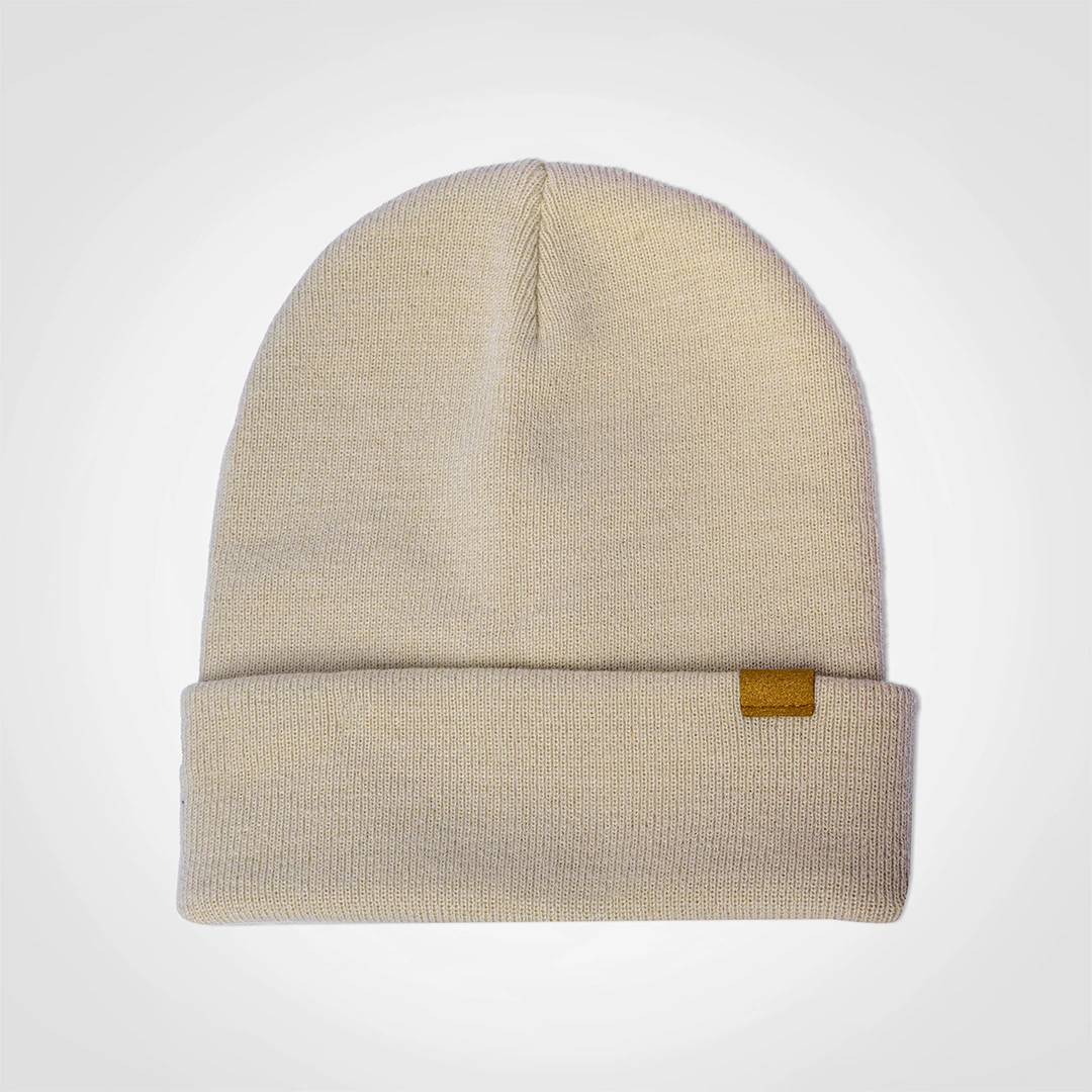 Cream knit beanie shown from the front.