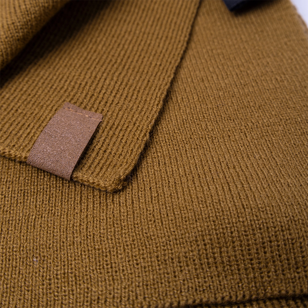 Close-up of brown knit fabric texture.