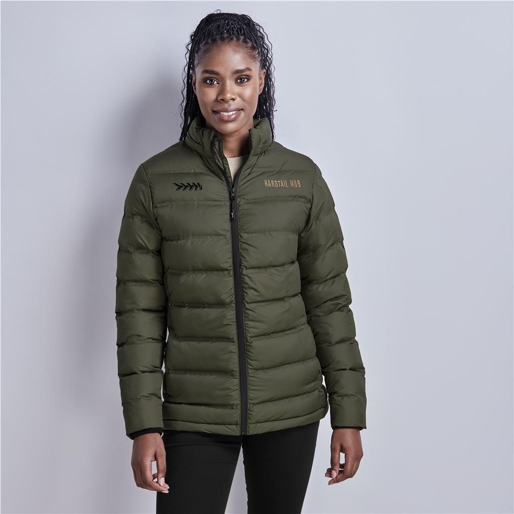Female model wearing an olive green puffer jacket.
