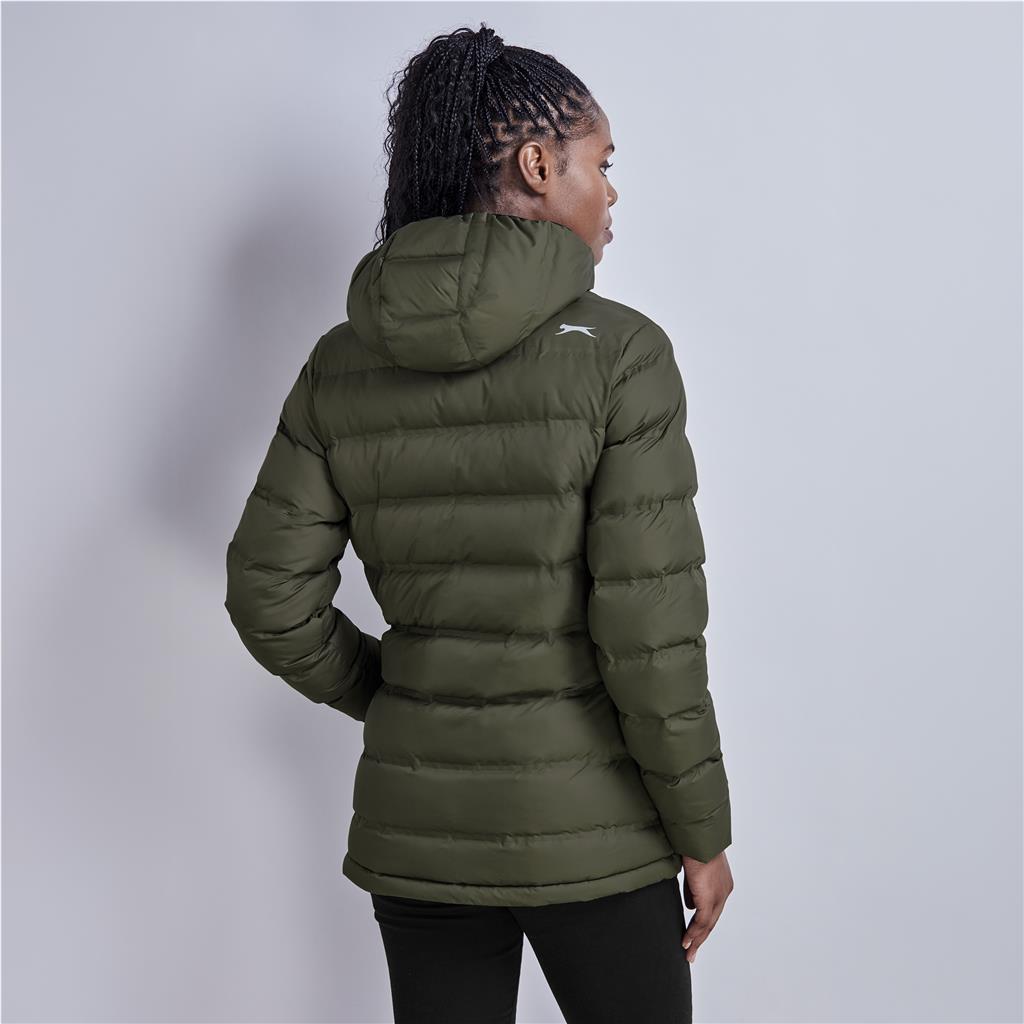 Female model wearing an olive green puffer jacket from a side angle