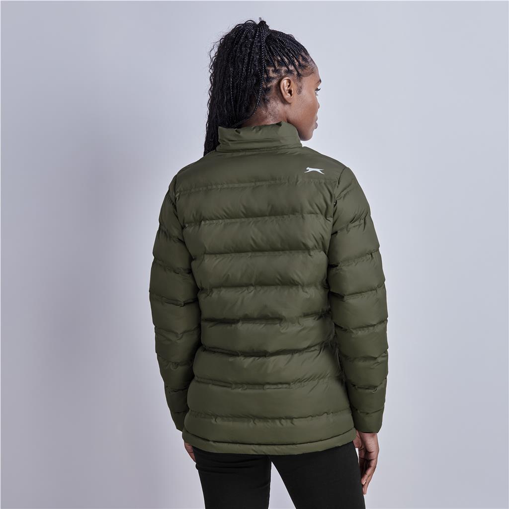 Female model wearing an olive green puffer jacket from the back.