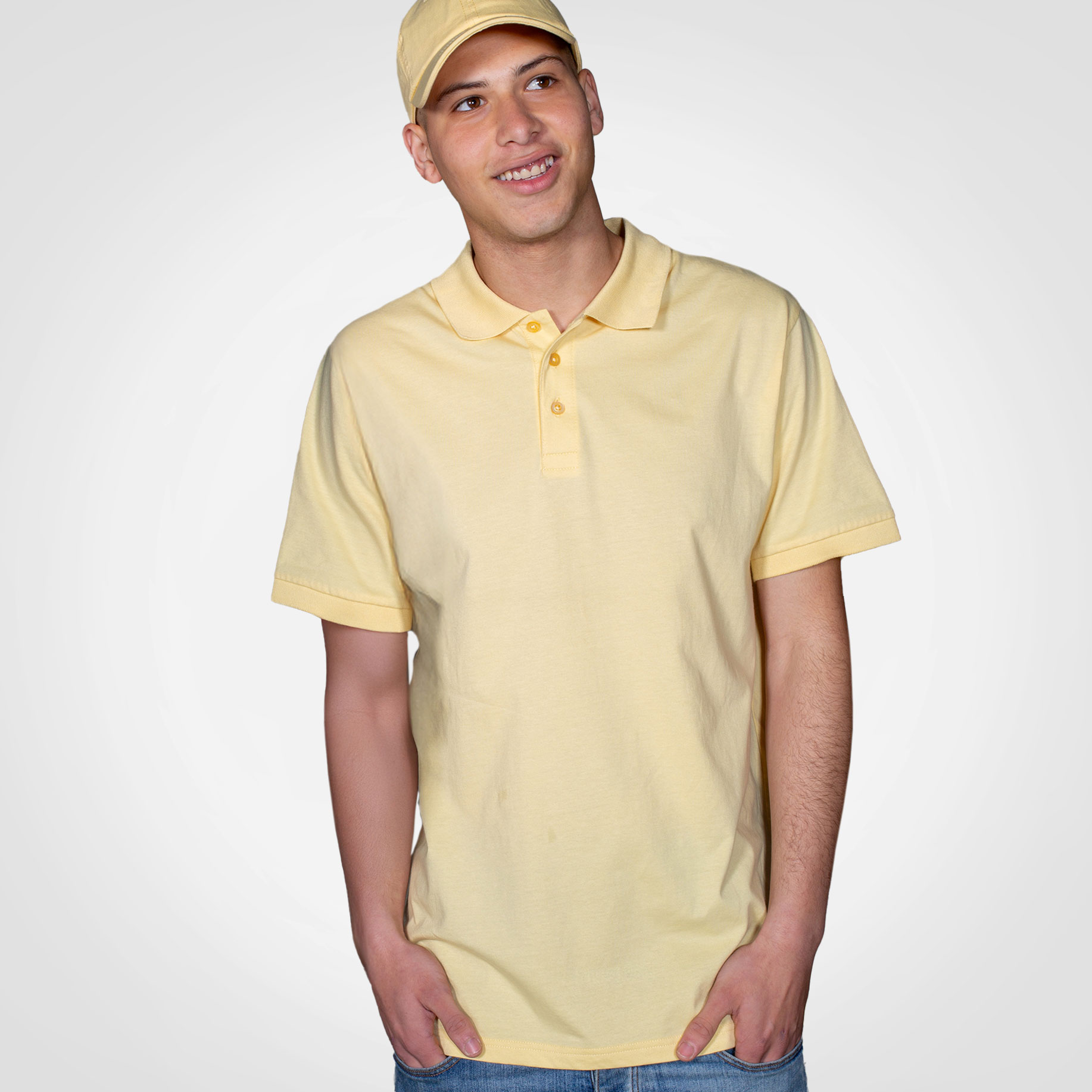 Male model wearing a pale yellow Mainline Sportswear polo shirt.